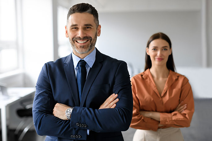 Two team members stand side by side.